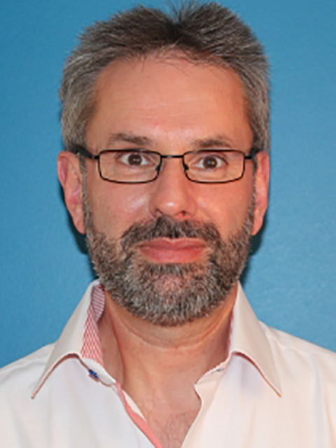 Portrait photograph of academic visitor to the School of Architecture, Building and Civil Engineering at Loughborough University, Alastair Cox